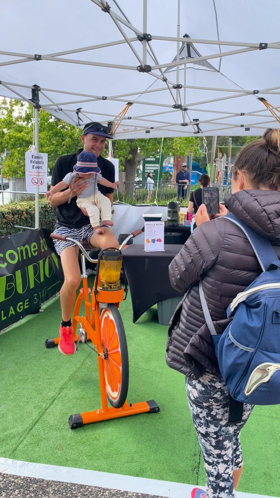 Staff serve guests at the Smoothie Bikes table